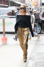 HAILEY BALDWIN in a Gold Pants Out in New York 02/09/2018