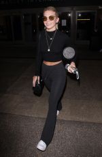 LOUISA JOHNSON at LAX Airport in Los Angeles 02/16/2018