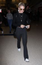 LOUISA JOHNSON at LAX Airport in Los Angeles 02/16/2018