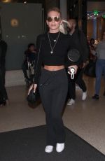 LOUISA JOHNSON at LAX Airport in Los Angeles 02/16/2018