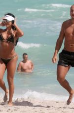 METISHA SCHAEFER in Bikini on the Beach in Miami 02/25/2018