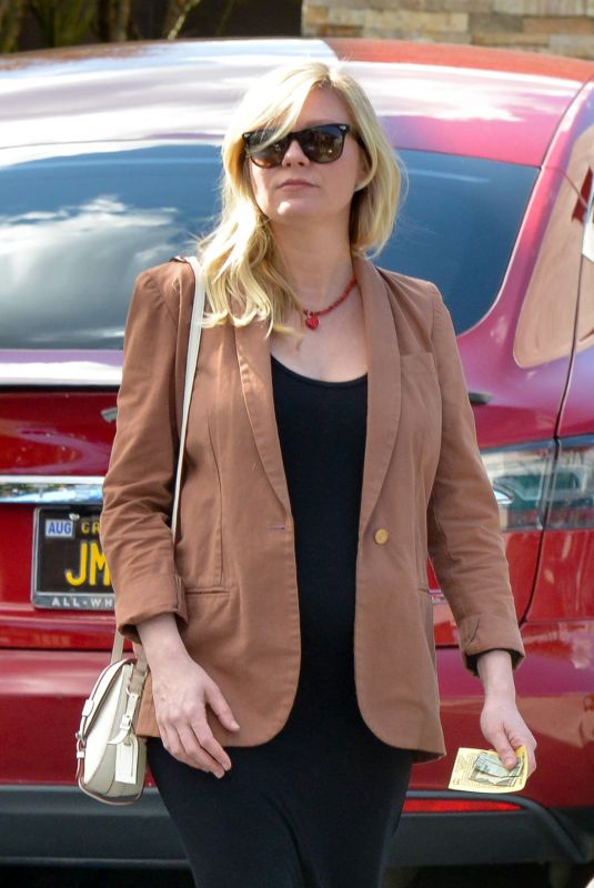 Pregnant KIRSTEN DUNST Picks Up Her Car from a Valet in West Hollywood 02/13/2018