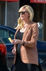 Pregnant KIRSTEN DUNST Picks Up Her Car from a Valet in West Hollywood 02/13/2018