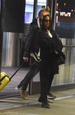 ZOE SALDANA and Marco Perego at LAX Airport in Los Angeles 02/01/2018
