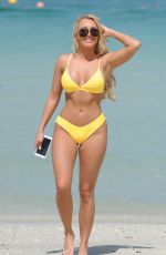 AMBER TURNER in Yellow Bikini at a Beach in Dubai 03/09/2018