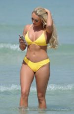 AMBER TURNER in Yellow Bikini at a Beach in Dubai 03/09/2018