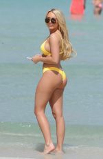 AMBER TURNER in Yellow Bikini at a Beach in Dubai 03/09/2018