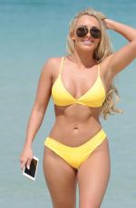 AMBER TURNER in Yellow Bikini at a Beach in Dubai 03/09/2018