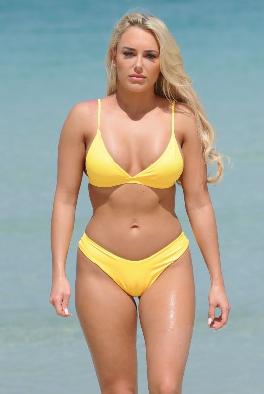 AMBER TURNER in Yellow Bikini at a Beach in Dubai 03/09/2018