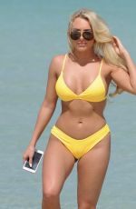 AMBER TURNER in Yellow Bikini at a Beach in Dubai 03/09/2018