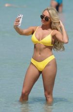 AMBER TURNER in Yellow Bikini at a Beach in Dubai 03/09/2018