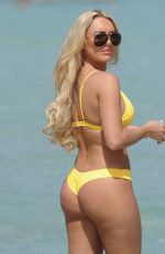 AMBER TURNER in Yellow Bikini at a Beach in Dubai 03/09/2018