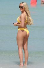 AMBER TURNER in Yellow Bikini at a Beach in Dubai 03/09/2018
