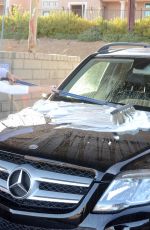 ANA BRAGA Washing Her Car in Calabasas 03/18/2018