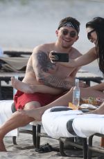 BRE TIESI in Bikini and Johnny Manziel at a Beach in Miami 03/01/2018