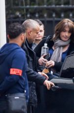 CARLA BRUNI-SARKOZY Leaves Her Home in Paris 03/23/2018