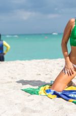 CLAUDIA ROMANI Celebrates Saint Patricks Day at a Beach in Miami 03/17/2018