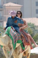 DANIELLE LLOYD in Bikini Riding a Camel on the Beach in Dubai 03/30/2018