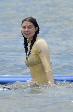 KIRA KOSARIN in Bikini Out Surfing in Maui 03/27/2018