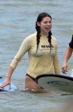 KIRA KOSARIN in Bikini Out Surfing in Maui 03/27/2018