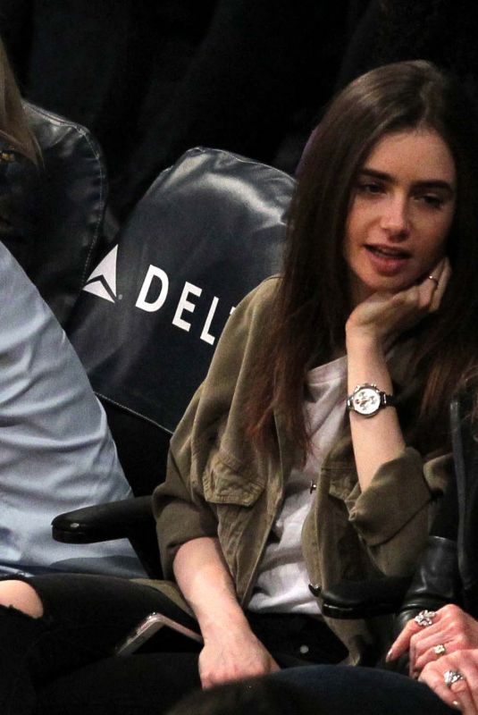 LILY COLLINS at Lakers Game at Staples Center in Los Angeles 03/28/2018