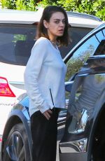 MILA KUNIS Returns to Her Tesla Model 3 Car in Los Angeles 03/27/2018