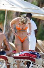 OLIVIA BUCKLAND in a Orange Bikini at a Beach in Barbados 03/13/2018
