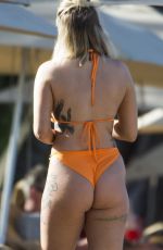 OLIVIA BUCKLAND in a Orange Bikini at a Beach in Barbados 03/13/2018