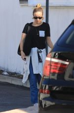 OLIVIA WILDE Leaves Hugo