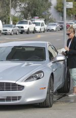 SOPHIA THOMALLA at a Gas Station with Her Aston Martin in Los Angeles 03/20/2018