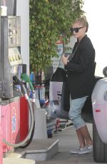 SOPHIA THOMALLA at a Gas Station with Her Aston Martin in Los Angeles 03/20/2018