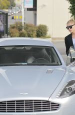 SOPHIA THOMALLA at a Gas Station with Her Aston Martin in Los Angeles 03/20/2018