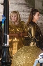 ANNE HATHAWAY and REBEL WILSON on the Set of THe Hustle in London 04/12/2018