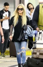 CARMEN ELECTRA Arrives at Airport in Miami 04/13/2018