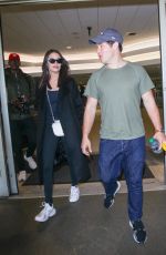 CHLOE BRIDGES and Adam Devine at LAX Airport in Los Angeles 04/20/2018