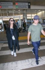 CHLOE BRIDGES and Adam Devine at LAX Airport in Los Angeles 04/20/2018