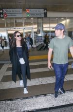 CHLOE BRIDGES and Adam Devine at LAX Airport in Los Angeles 04/20/2018