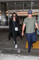 CHLOE BRIDGES and Adam Devine at LAX Airport in Los Angeles 04/20/2018