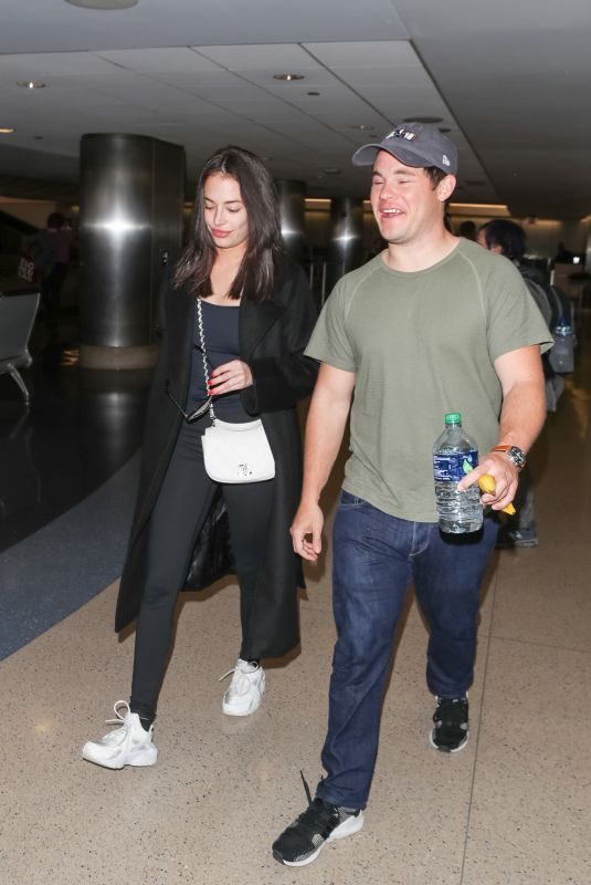 CHLOE BRIDGES and Adam Devine at LAX Airport in Los Angeles 04/20/2018