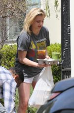 CHLOE MORETZ Receives Food Delivery at Her Home in Los Angeles 04/05/2018