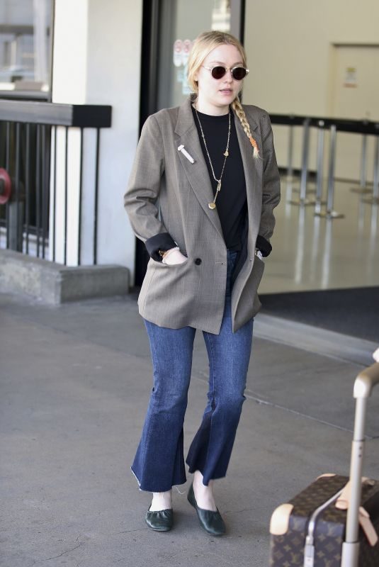 DAKOTA FANNING at LAX Airport in Los Angeles 04/17/2018