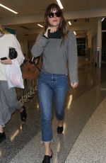 DAKOTA JOHNSON Arrives at LAX Airport in Los Angeles 04/03/2018