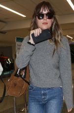 DAKOTA JOHNSON Arrives at LAX Airport in Los Angeles 04/03/2018