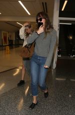 DAKOTA JOHNSON Arrives at LAX Airport in Los Angeles 04/03/2018