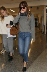 DAKOTA JOHNSON Arrives at LAX Airport in Los Angeles 04/03/2018