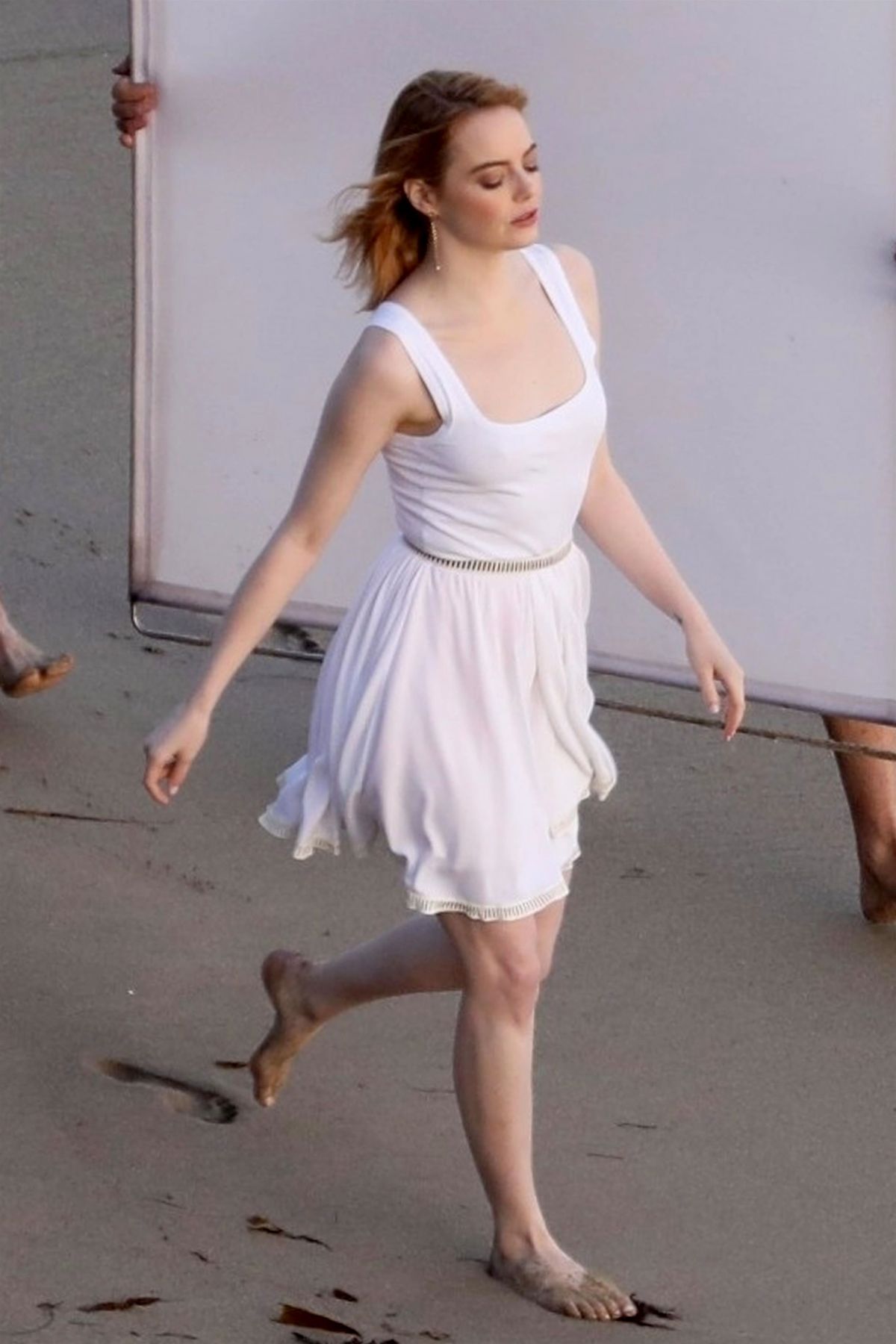 EMMA STONE on the Set of a Photoshoot at a Beach in Miami 04/25/2018. 
