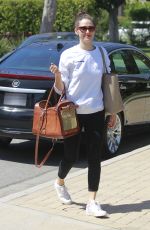 EMMY ROSSUM with Her Dog in a Pet Purse Out in Hollywood 04/11/2018