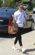 EMMY ROSSUM with Her Dog in a Pet Purse Out in Hollywood 04/11/2018