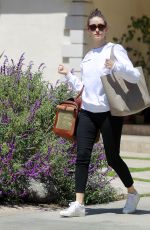 EMMY ROSSUM with Her Dog in a Pet Purse Out in Hollywood 04/11/2018