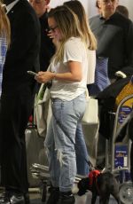HILARY DUFF with Her Dog at LAX Airport in Los Angeles 04/12/2018